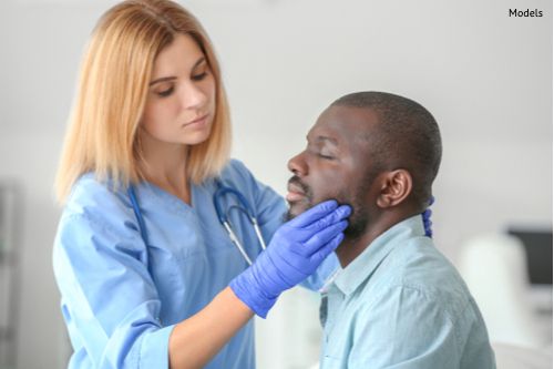 A man at his consultation for a facelift after completing steps to find out if he is ready for a plastic surgery procedure.
