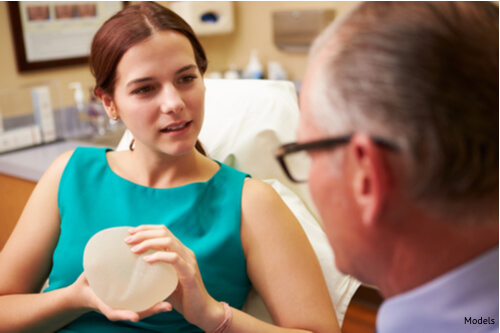 A woman at her consultation for a breast reconstruction surgery. She will choose an implant reconstruction because she has enough tissue.