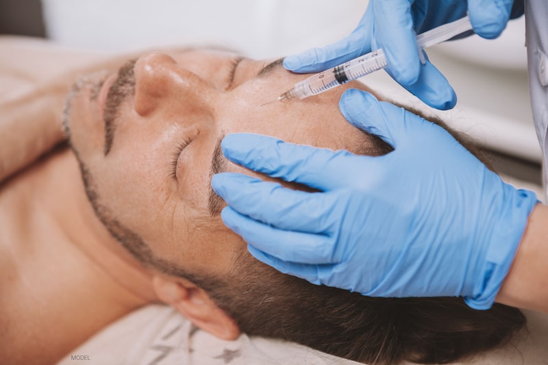 Man getting BOTOX® Cosmetic in his forehead. 